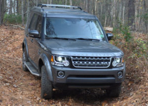Land Rover LR4 offroad in the woods and forest